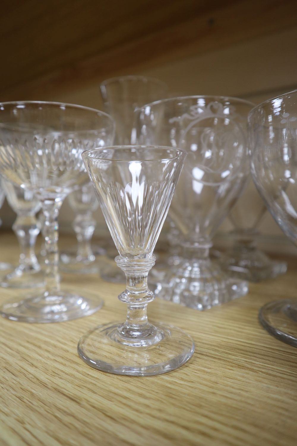 A group of four mid 19th century glass rummers, various cut glass champagne flutes etc.